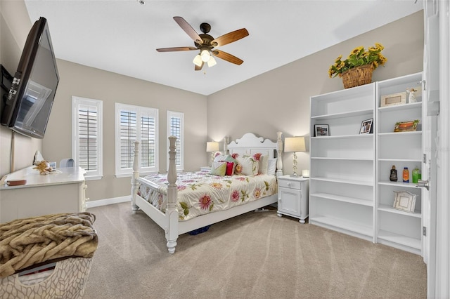 2756 Reserve Ct, Dunedin, FL 34698 - bedroom with light carpet and ceiling fan