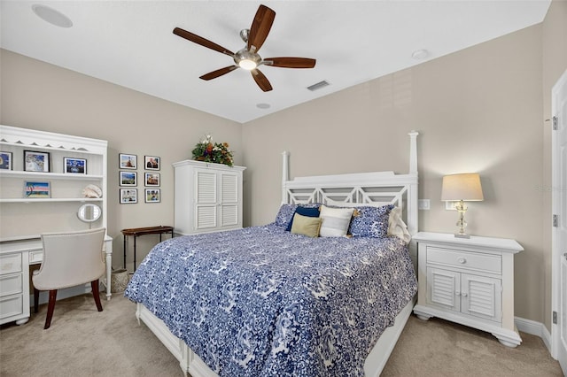 2756 Reserve Ct, Dunedin, FL 34698 - bedroom with light carpet, a desk, and ceiling fan