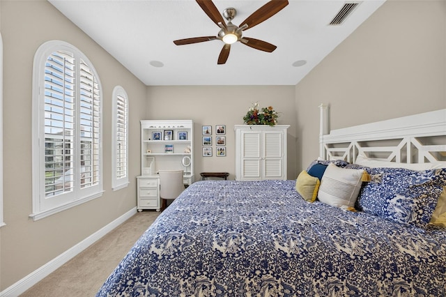 2756 Reserve Ct, Dunedin, FL 34698 - bedroom featuring light carpet, multiple windows, and ceiling fan