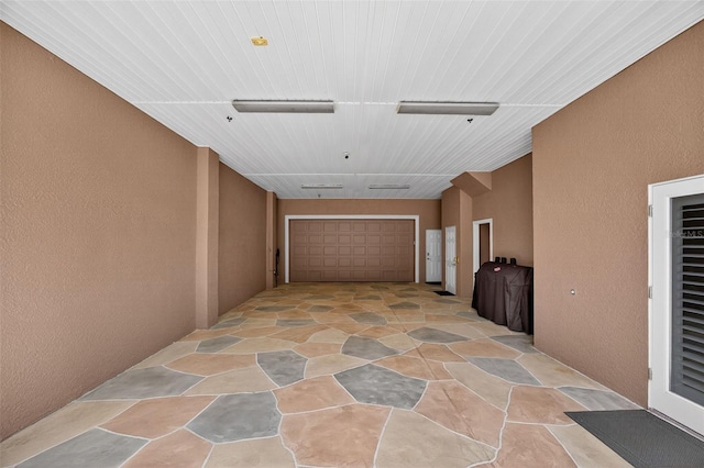 2756 Reserve Ct, Dunedin, FL 34698 - corridor featuring light stone finish floors, a textured wall, and wood ceiling