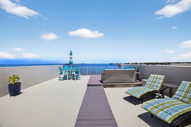 2756 Reserve Ct, Dunedin, FL 34698 - dock area featuring a water view and an outdoor living space