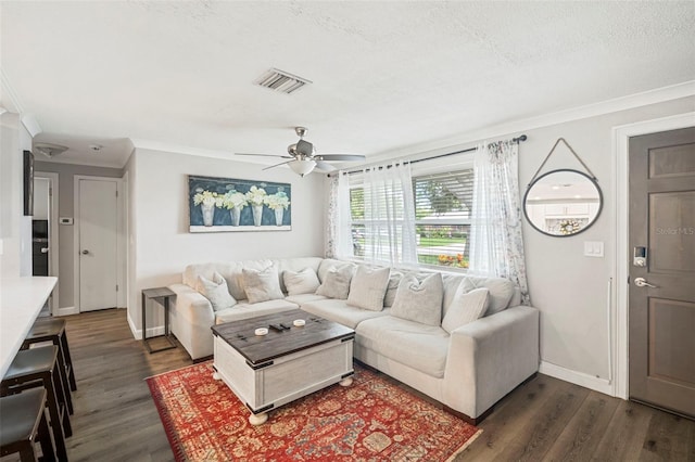 980 8th Ave NE, Largo, FL 33770 - living room featuring ornamental molding, dark wood finished floors, a ceiling fan, and a textured ceiling