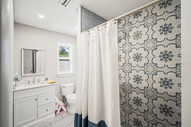 980 8th Ave NE, Largo, FL 33770 - bathroom featuring vanity, a shower with shower curtain, tile patterned flooring, and recessed lighting