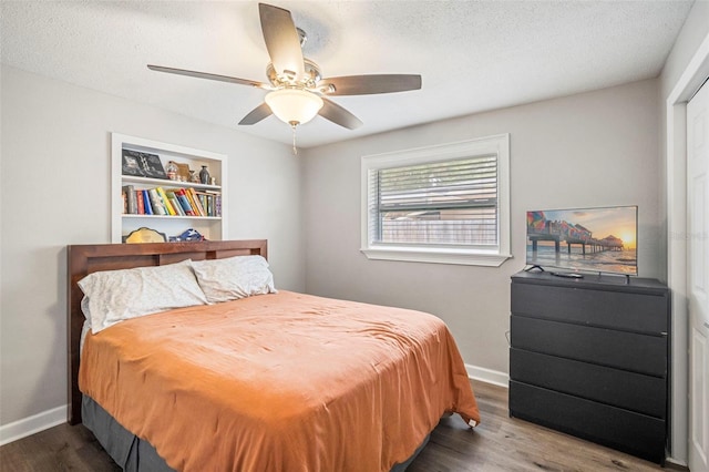 980 8th Ave NE, Largo, FL 33770 - bedroom with wood finished floors, ceiling fan, and a textured ceiling