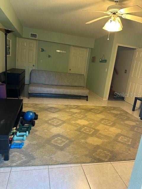 9810 Indian Key Trl Unit 85, Seminole, FL 33776 - unfurnished living room featuring a ceiling fan and tile patterned flooring