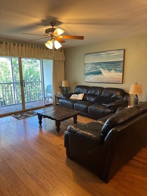 9810 Indian Key Trl Unit 85, Seminole, FL 33776 - living room with ceiling fan and wood finished floors