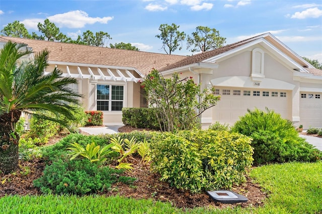 2468 Magnolia Cir, North Port, FL 34289 - view of front of home with an attached garage and stucco siding