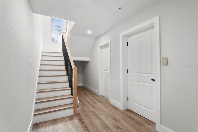 11605 1st St E Unit 3, Treasure Island, FL 33706 - stairway featuring wood finished floors and recessed lighting