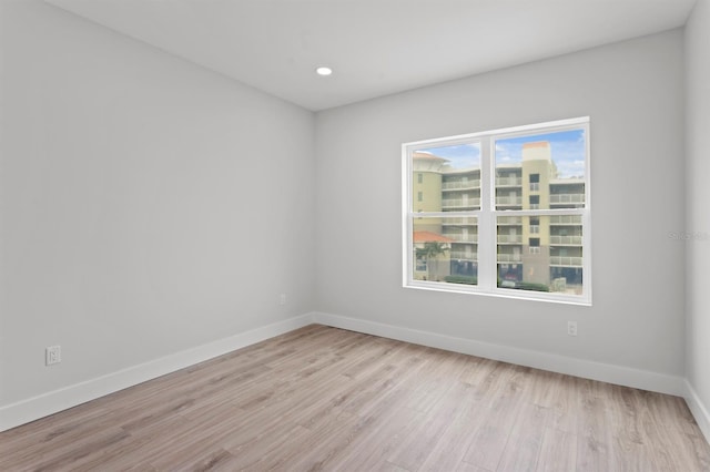 11605 1st St E Unit 3, Treasure Island, FL 33706 - unfurnished room with wood finished floors and recessed lighting