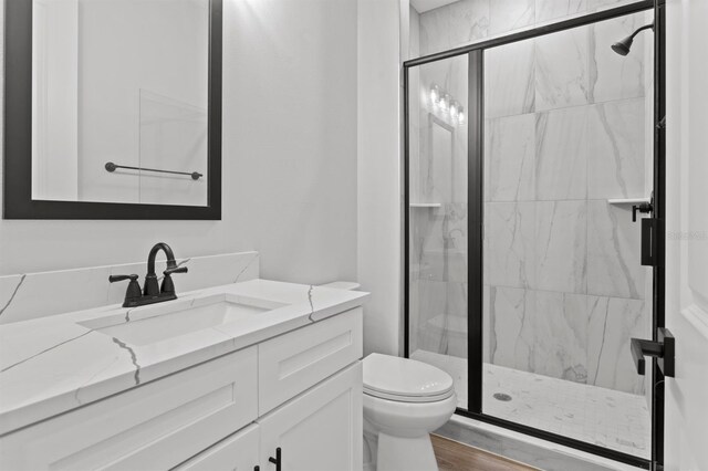 11605 1st St E Unit 3, Treasure Island, FL 33706 - full bath featuring vanity, a marble finish shower, and wood finished floors