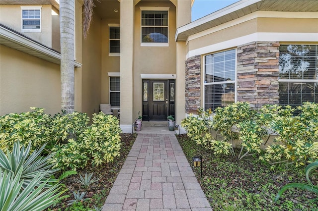 1872 Eloise Cove Dr, Winter Haven, FL 33884 - view of exterior entry featuring stucco siding and stone siding