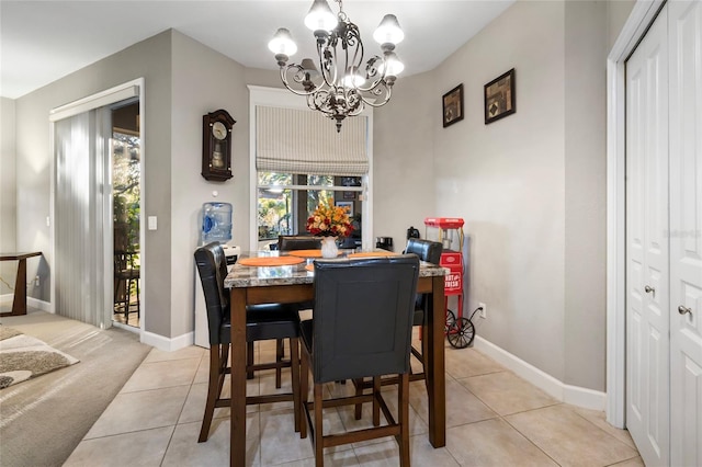 1872 Eloise Cove Dr, Winter Haven, FL 33884 - dining area featuring a chandelier and light tile patterned floors