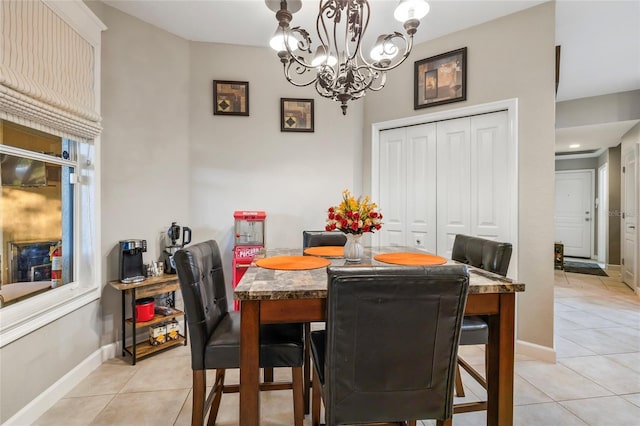 1872 Eloise Cove Dr, Winter Haven, FL 33884 - dining area featuring light tile patterned floors and a chandelier