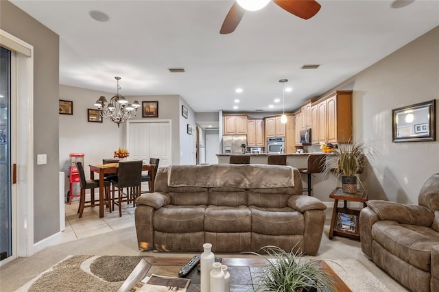 1872 Eloise Cove Dr, Winter Haven, FL 33884 - living room with light colored carpet, a chandelier, ceiling fan, and light tile patterned flooring