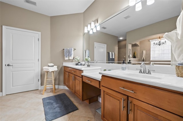 1872 Eloise Cove Dr, Winter Haven, FL 33884 - full bathroom with double vanity, tile patterned floors, and a chandelier