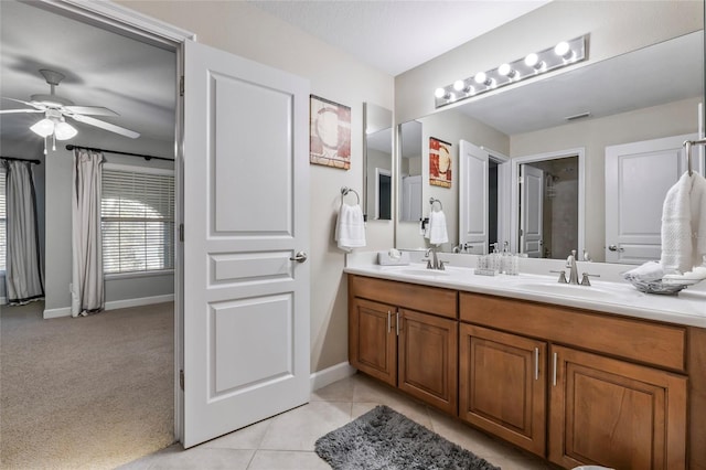 1872 Eloise Cove Dr, Winter Haven, FL 33884 - full bath featuring double vanity, ceiling fan, and tile patterned flooring