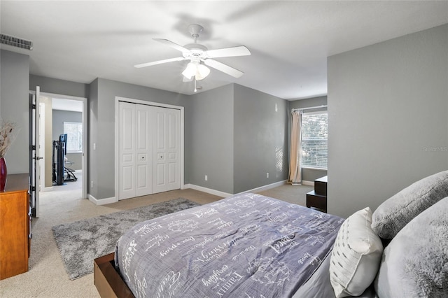 1872 Eloise Cove Dr, Winter Haven, FL 33884 - bedroom with carpet flooring, a closet, and a ceiling fan
