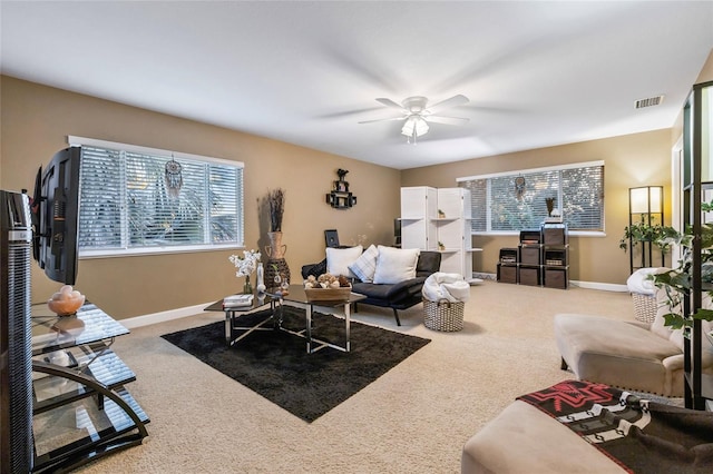 1872 Eloise Cove Dr, Winter Haven, FL 33884 - living room with healthy amount of natural light, carpet floors, and a ceiling fan