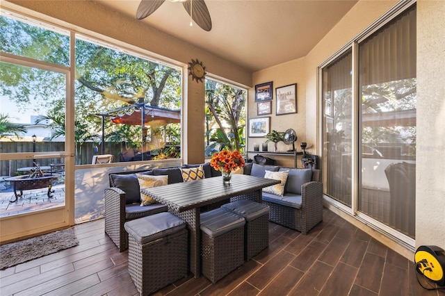 1872 Eloise Cove Dr, Winter Haven, FL 33884 - sunroom / solarium featuring ceiling fan, outdoor dining space, and a fire pit