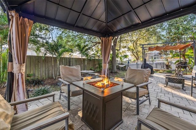 1872 Eloise Cove Dr, Winter Haven, FL 33884 - fenced backyard featuring a patio, an outdoor living space with a fire pit, and a gazebo