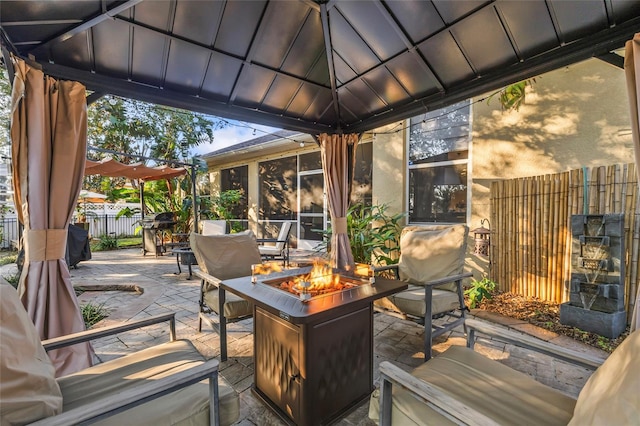 1872 Eloise Cove Dr, Winter Haven, FL 33884 - view of patio featuring an outdoor fire pit and a sunroom