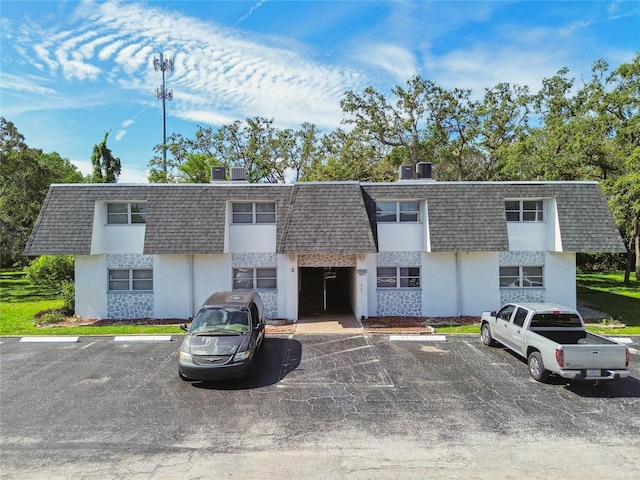 3415 Tricon Ln Unit 13, Holiday, FL 34691 - view of building exterior with uncovered parking