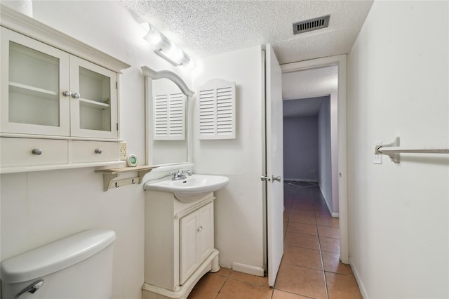 3415 Tricon Ln Unit 13, Holiday, FL 34691 - bathroom with vanity, tile patterned flooring, and a textured ceiling
