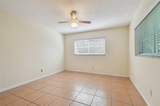 3415 Tricon Ln Unit 13, Holiday, FL 34691 - unfurnished room with a textured ceiling, ceiling fan, and light tile patterned flooring