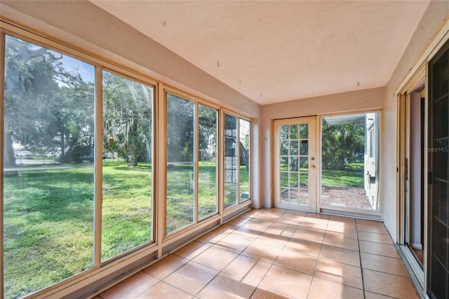 3415 Tricon Ln Unit 13, Holiday, FL 34691 - unfurnished sunroom with tile patterned floors
