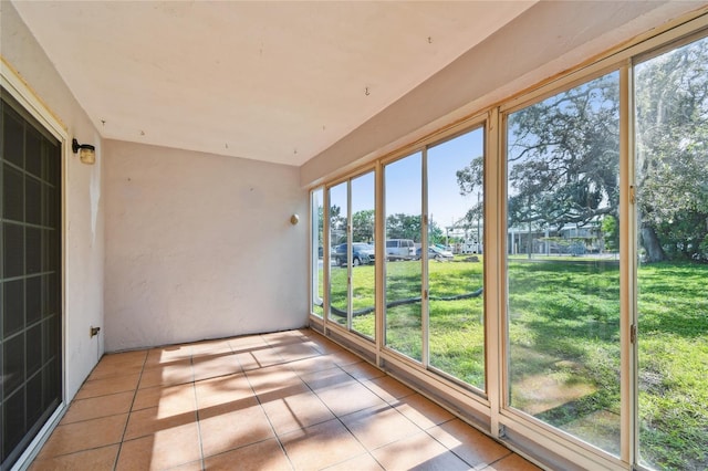 3415 Tricon Ln Unit 13, Holiday, FL 34691 - unfurnished sunroom with tile patterned floors