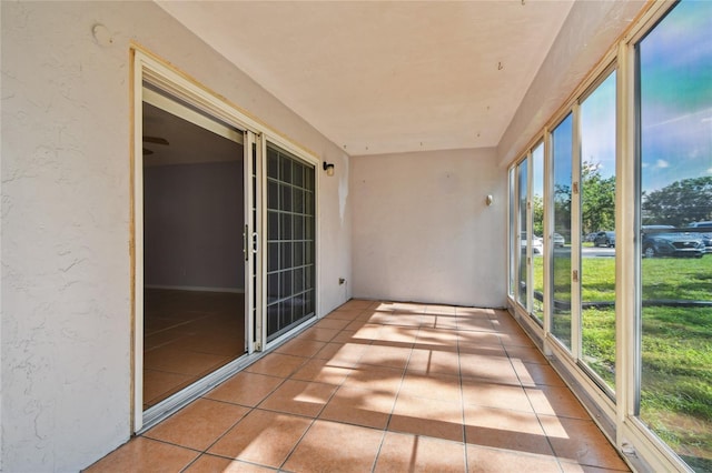 3415 Tricon Ln Unit 13, Holiday, FL 34691 - unfurnished sunroom with tile patterned floors