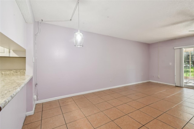 3415 Tricon Ln Unit 13, Holiday, FL 34691 - unfurnished dining area with light tile patterned floors and baseboards