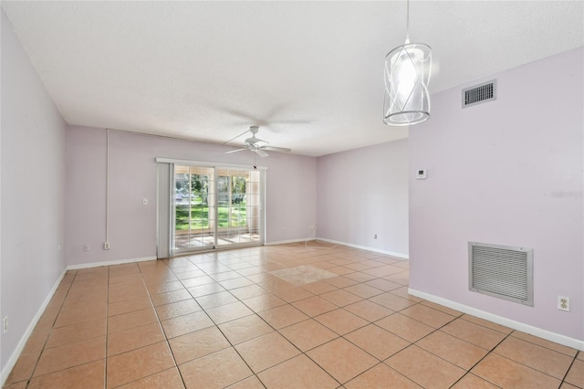 3415 Tricon Ln Unit 13, Holiday, FL 34691 - empty room with ceiling fan and light tile patterned floors