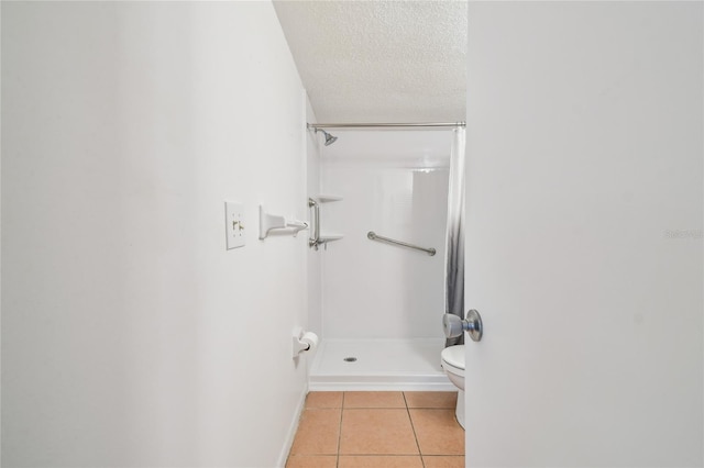 3415 Tricon Ln Unit 13, Holiday, FL 34691 - full bath with tile patterned flooring, a stall shower, and a textured ceiling
