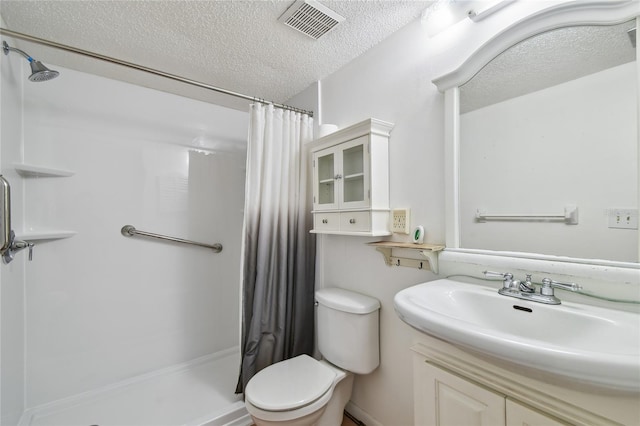 3415 Tricon Ln Unit 13, Holiday, FL 34691 - bathroom featuring a stall shower, a textured ceiling, and vanity