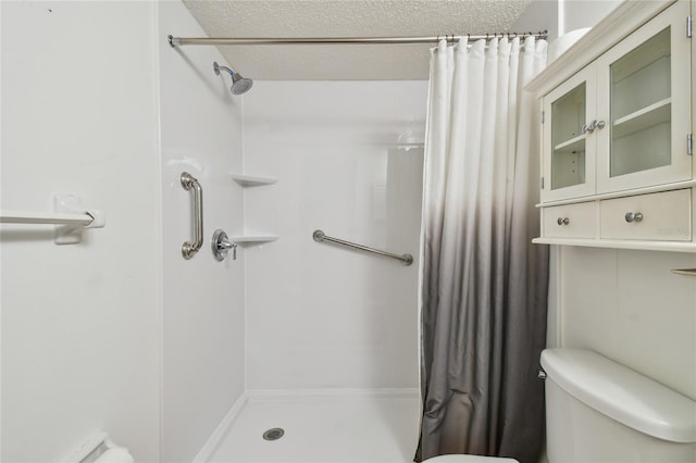 3415 Tricon Ln Unit 13, Holiday, FL 34691 - bathroom with a stall shower and a textured ceiling