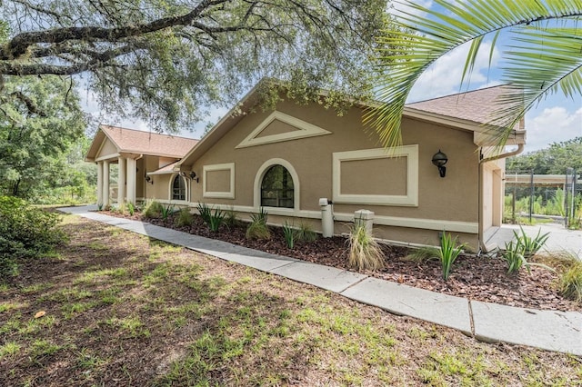 3685 N Palomino Ter, Beverly Hills, FL 34465 - view of front of property featuring stucco siding and a shingled roof