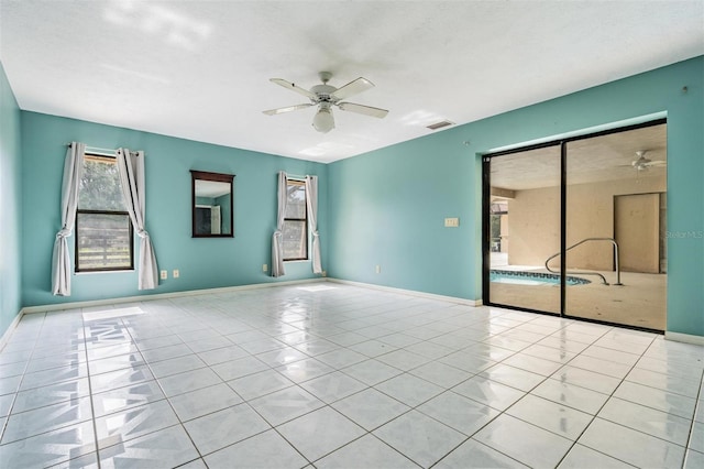 3685 N Palomino Ter, Beverly Hills, FL 34465 - tiled spare room with ceiling fan and baseboards