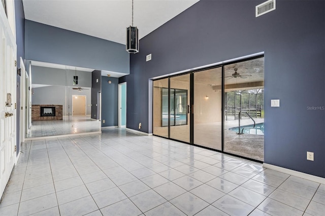 3685 N Palomino Ter, Beverly Hills, FL 34465 - tiled empty room featuring ceiling fan and a high ceiling