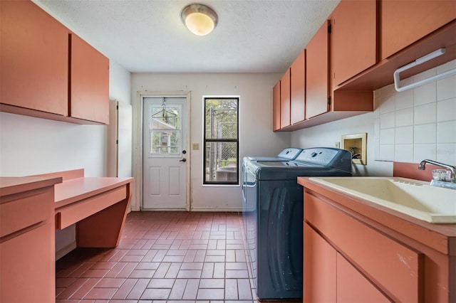 3685 N Palomino Ter, Beverly Hills, FL 34465 - laundry room featuring washing machine and clothes dryer, cabinet space, brick patterned flooring, and a textured ceiling
