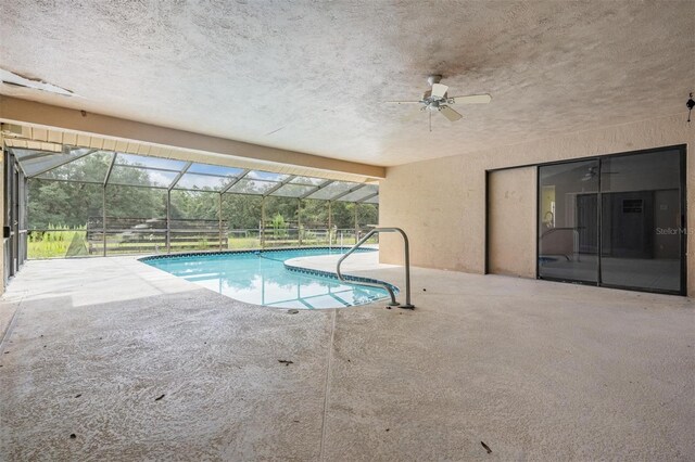 3685 N Palomino Ter, Beverly Hills, FL 34465 - outdoor pool with a patio area, ceiling fan, and glass enclosure