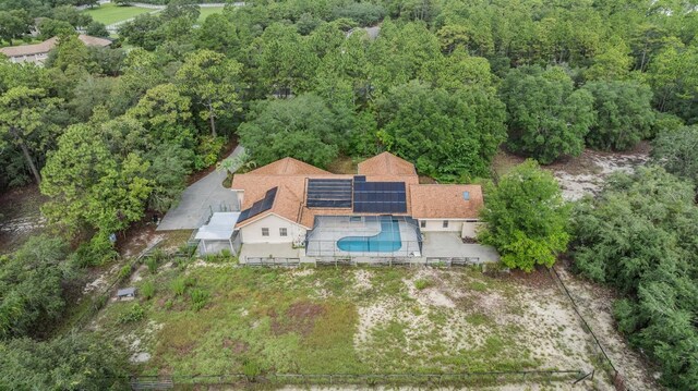 3685 N Palomino Ter, Beverly Hills, FL 34465 - aerial view of property and surrounding area with a pool and a heavily wooded area