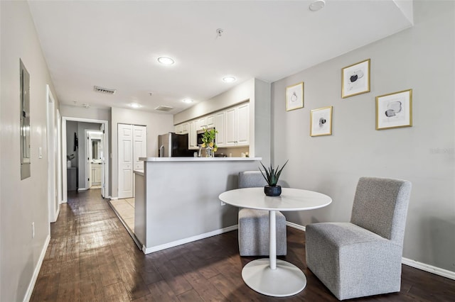 1914 E 4th Ave Unit 2, Tampa, FL 33605 - kitchen with stainless steel appliances, a peninsula, hardwood / wood-style flooring, recessed lighting, and white cabinets