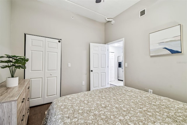 1914 E 4th Ave Unit 2, Tampa, FL 33605 - bedroom with a closet, dark wood-type flooring, a high ceiling, fridge with ice dispenser, and a ceiling fan