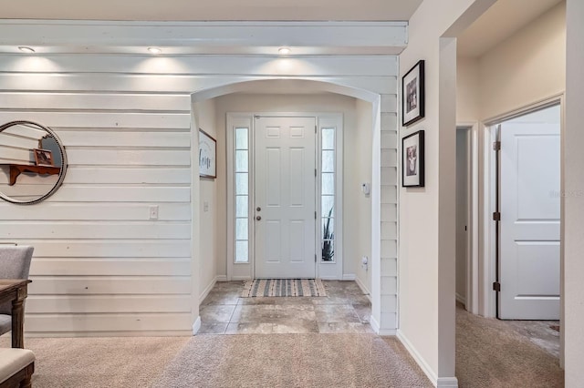 6307 Shadowlake Dr, Apollo Beach, FL 33572 - foyer entrance with arched walkways and light carpet