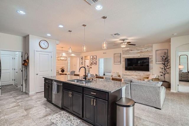 6307 Shadowlake Dr, Apollo Beach, FL 33572 - kitchen featuring dishwasher, ceiling fan, an island with sink, open floor plan, and light stone countertops
