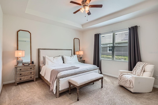 6307 Shadowlake Dr, Apollo Beach, FL 33572 - bedroom with light carpet, a tray ceiling, and ceiling fan