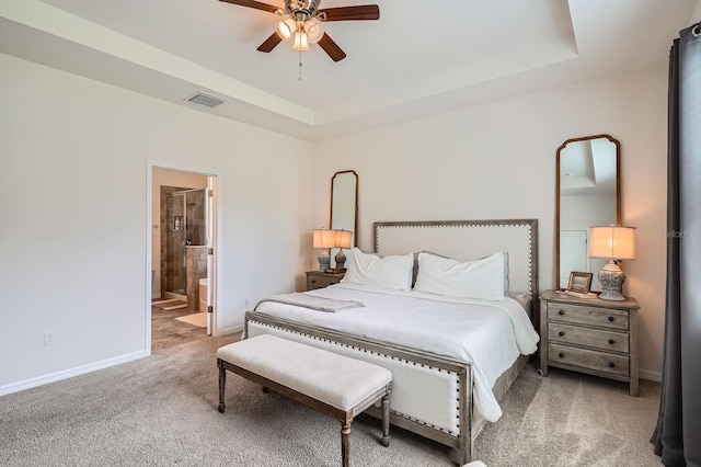 6307 Shadowlake Dr, Apollo Beach, FL 33572 - bedroom with carpet flooring, a raised ceiling, ensuite bathroom, and ceiling fan