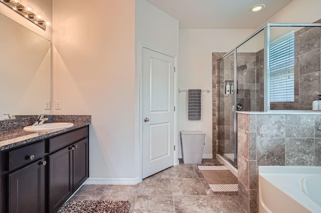 6307 Shadowlake Dr, Apollo Beach, FL 33572 - full bathroom featuring vanity, a shower stall, and a garden tub