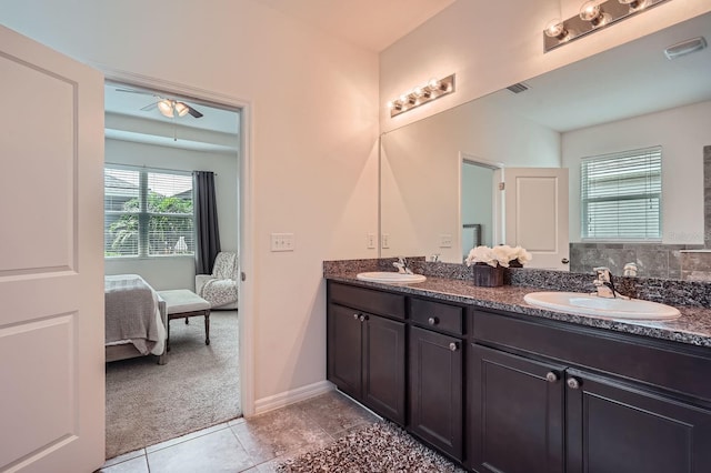 6307 Shadowlake Dr, Apollo Beach, FL 33572 - full bath featuring double vanity, connected bathroom, tile patterned floors, and ceiling fan